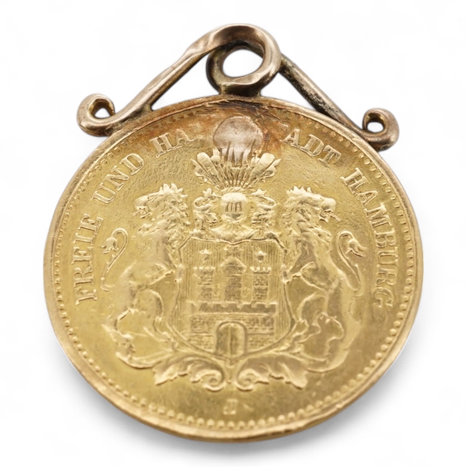 A German 1877 5 mark gold coin, now mounted on a yellow metal pendant mount, gross weight 2.2 grams.